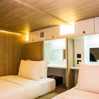 Twin Capsule Suite with Shared Bathroom