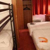 Quadruple Room with Four Single Beds and Bathroom