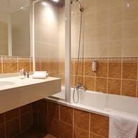 Deluxe Quadruple Room with Queen Bed and Kitchen