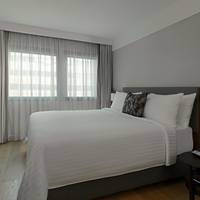 One Bedroom Suite with King Bed and Courtyard View