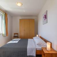 One-Bedroom Apartment with Balcony, Garden View and Pool View