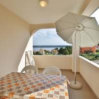 One-Bedroom Apartment with Balcony and Sea View