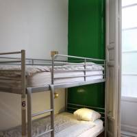 Bed in 8-Bed Dormitory Room with Shared Bathroom