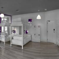Bed in 8-Bed Dormitory Room with Shared Bathroom