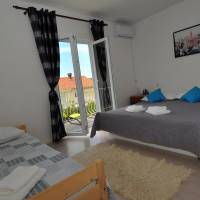 Four-Bedroom Apartment with Balcony and Garden View