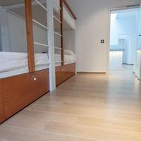 Bed in 4-Bed Dormitory Room with Shared Bathroom