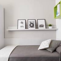 Two Connected Rooms With One Single Bed Each
