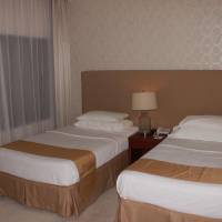 Classic Twin Bed Room with City View