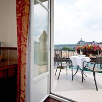 Double room with sofa bed, facing the Chapel Bridge and large balcony 19m2