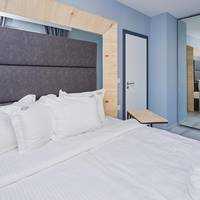One-Bedroom Apartment with Balcony and Partial Sea View (2 Adults + 2 Children)