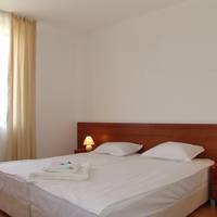 One-Bedroom Apartment with Balcony (2 Adults + 2 Children)