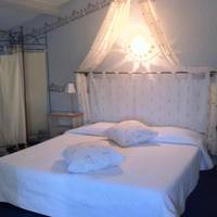 Room with One King Bed and Two Single Beds