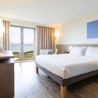 Classic sea side room with one queen size bed located on the upper floor