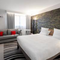Standard room with double bed and  sofa
