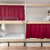 Bed in 4-Bed Dormitory Room with Shared Bathroom