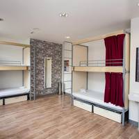Bed in 10-Bed Dormitory Room with Shared Bathroom