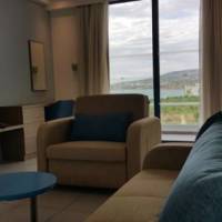 One-Bedroom Suite with Sea and Pool View