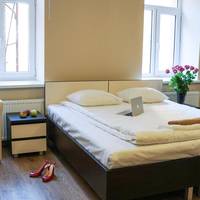 Superior Quadruple Room with one king size and two single beds and lounge area