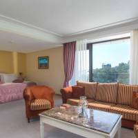 Deluxe Double Room with Balcony and Park View (2 Adults + 2 Children)