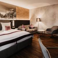 Junior Suite with Two Single Beds and One Sofa Bed