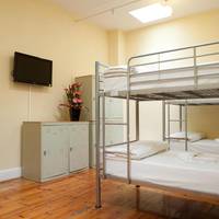 Bed in 6-Bed Male Dormitory Room with Shared Bathroom