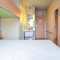 Room with One Queen Bed and One Bunk Bed
