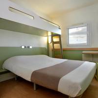 Room with One Queen Bed and One Bunk Bed