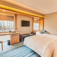 Premier King Room, Guest room, 1 King, Pool view with Happy hours (1+1 IMFL, Selected Brands) and 1 way airport transfers.