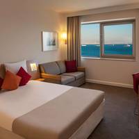 Standard Room With Queen Size Bed And Sofa