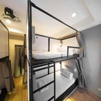 Bunk bed in mixed dorm with a bath room inside